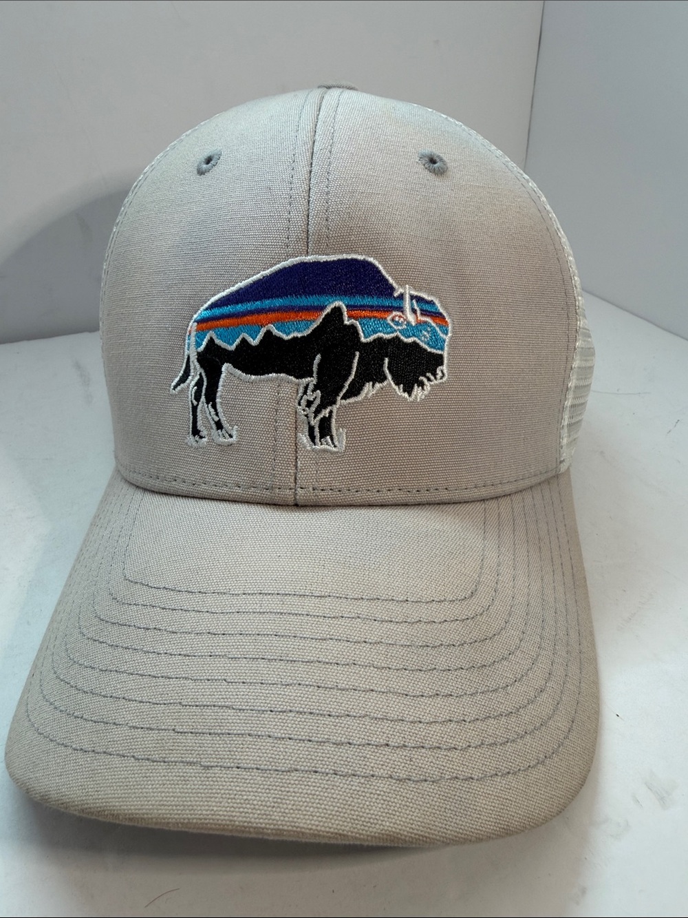 Patagonia Beige Trucker Hat with Buffalo Logo and Blue-Orange Stripe